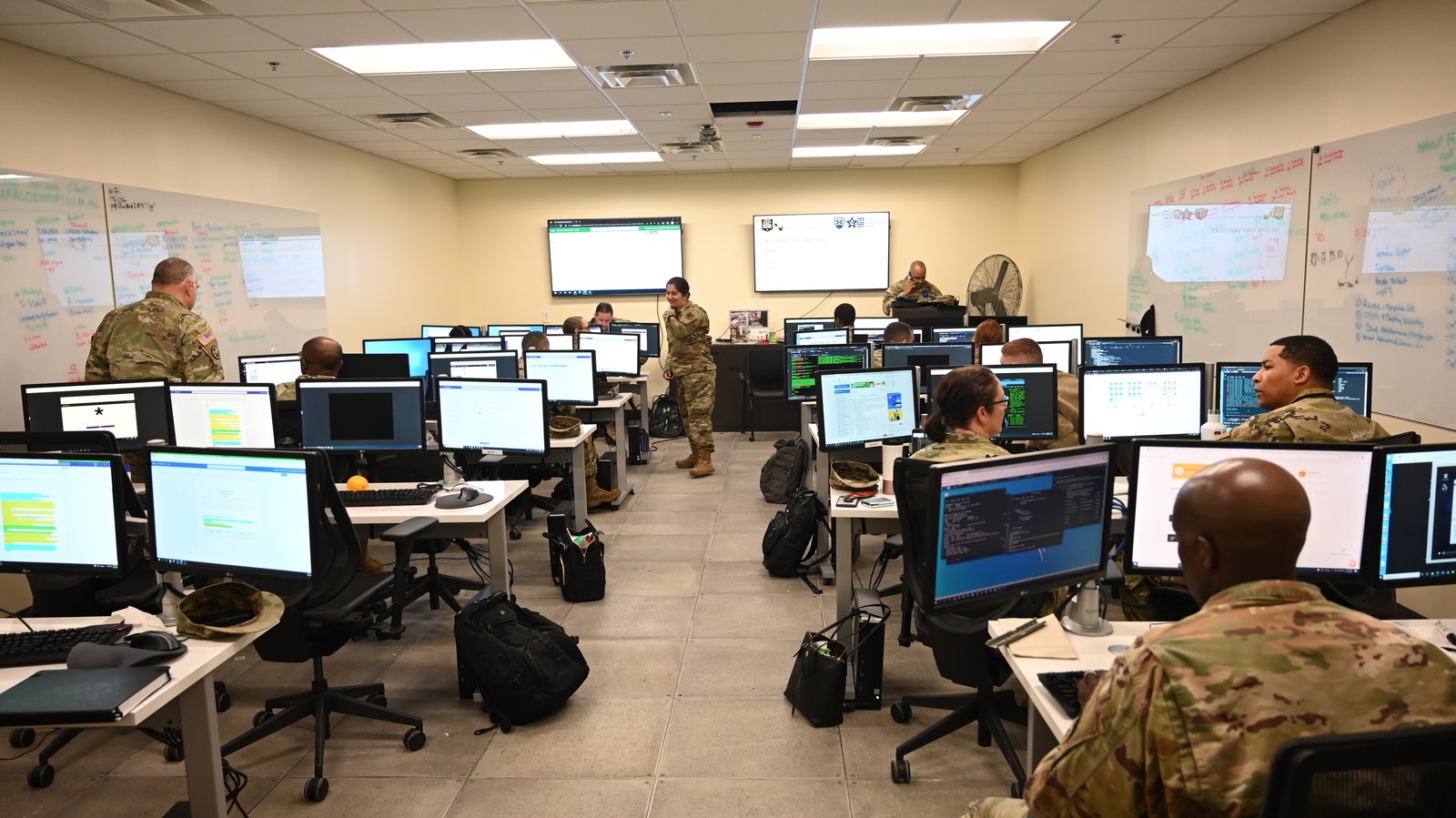 Cyber operators in a computer training room