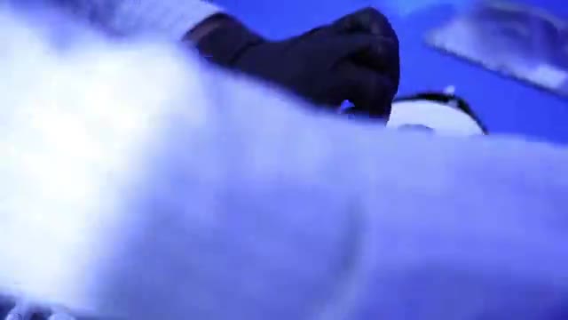 Civilian digital-forensics specialists use computers, electronic imaging and diagnostic equipment in a laboratory.